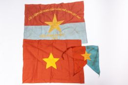An embroidered blue and red Vietcong flag, 26" x 19" dated 1966; another, red 24" x 18" with