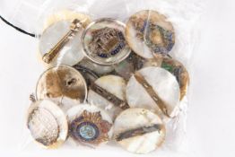 Thirteen regimental sweetheart brooches, of brass and enamel on mother of pearl discs, and three