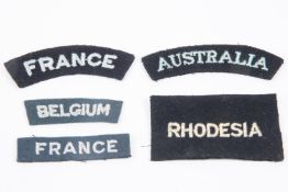 A selection of WWII Nationality titles: Australia, Belgium, Rhodesia, France straight, France curved