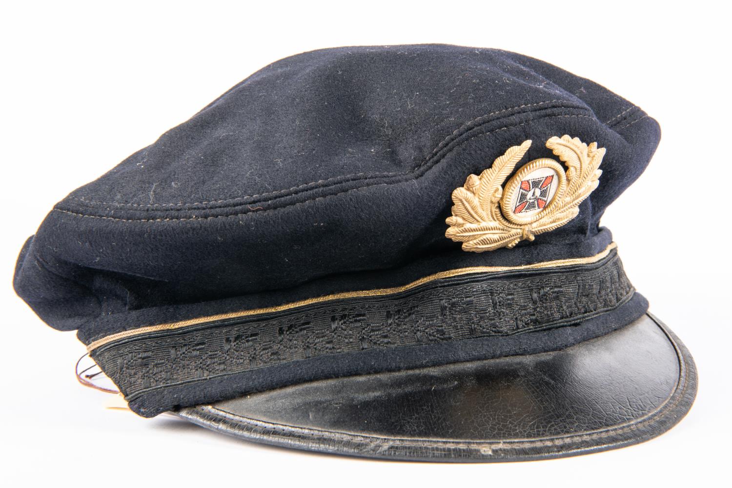 A Third Reich Veterans Association peaked cap, marked inside "Helvetia Ges Gesch", pressed metal