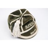 A Rugby football prize cap, green velvet with white piping, embroidered "B.S.R.F.C 1063-64". VGC £