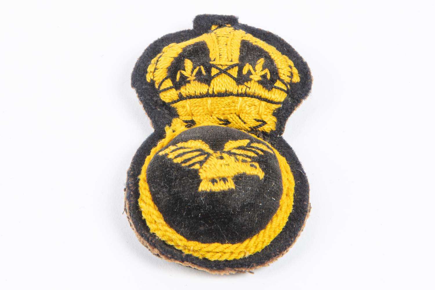 A good original WWI first pattern RAF cap badge, embroidered in yellow thread. £120-150