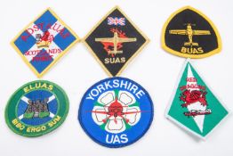 A large selection of RAF insignia, mostly post war University Squadron title, RAF Regiment titles,