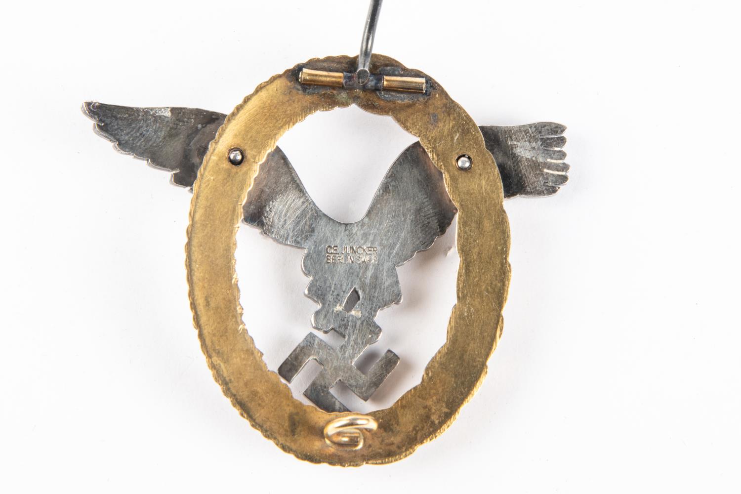 A Third Reich Luftwaffe observers breast badge, in silvered and gilt finish, marked on back "C E - Image 2 of 2