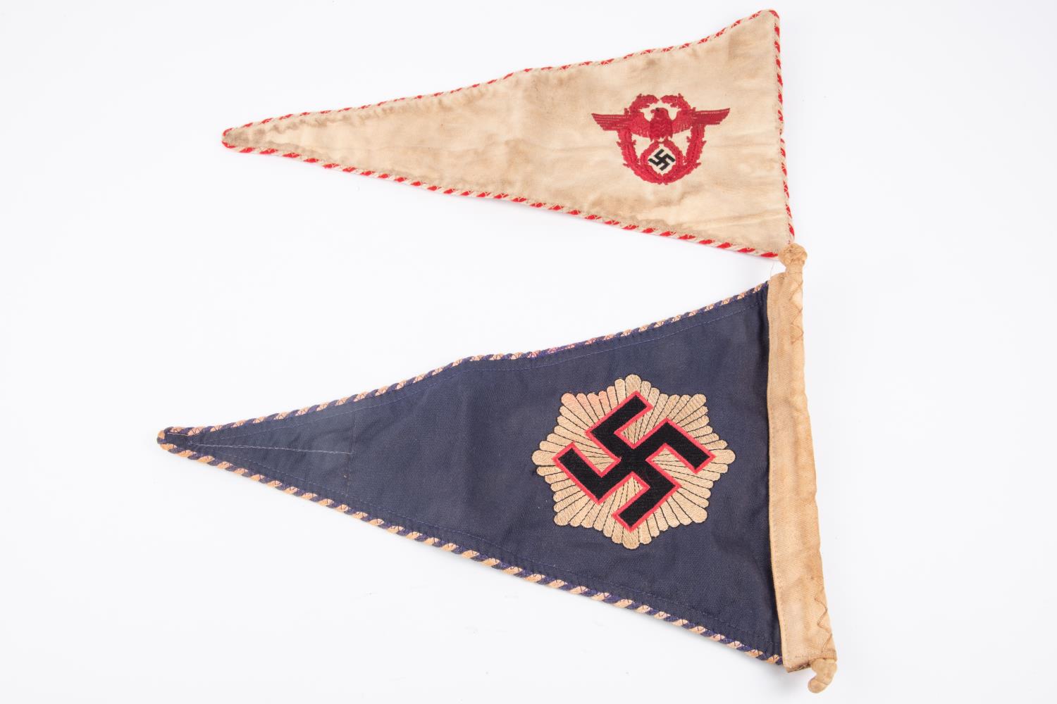 A good quality Third Reich car pennant of the R.L.B., woven swastika and star motif, braid edging;