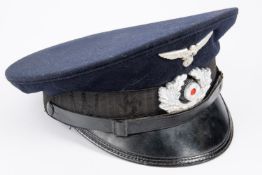 A Third Reich Veterans Association peaked cap, alloy insignia, trade label in lining marked "