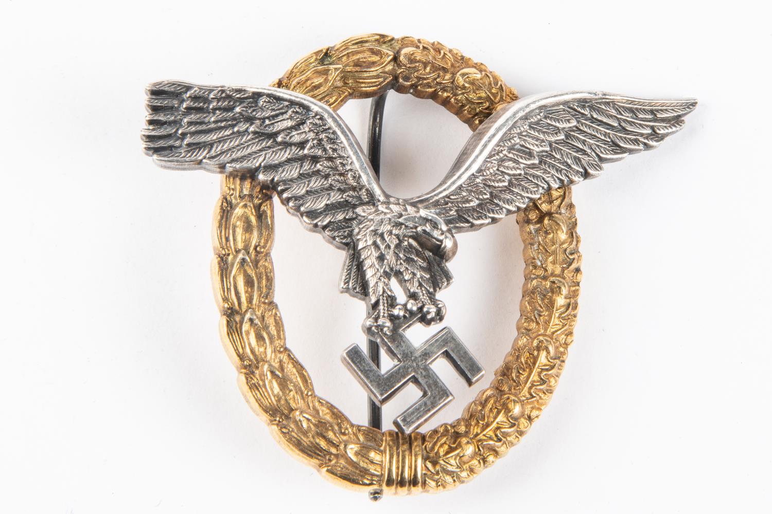A Third Reich Luftwaffe observers breast badge, in silvered and gilt finish, marked on back "C E
