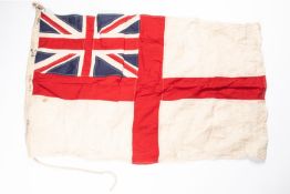 A R.N. ensign, stitched construction, edge marked "H.M.S. Badger", "1 YD. ENSIGN", "Admiralty", "