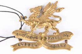 A WWI brass cap badge of the 11th (Lonsdale) Bn The Border Regt, with Gaunt, London plate. (KK