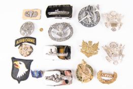 A quantity of post WWII US Army and Airforce insignia, cap badges, buckles etc. All in VGC £45-60