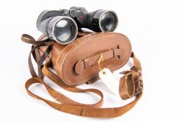 A pair of WWII Canadian Army binoculars, marked with broad arrows and "REL CANADA 1944", in their