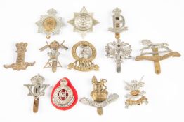 Twelve Cavalry cap badges: KDG (1915-37), chrome plated QDG, 3rd Carabiniers (lugs), 4/7th DG (