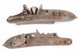 Two incomplete detached left hand locks from flintlock sporting guns, c 1820, one with safety bolt