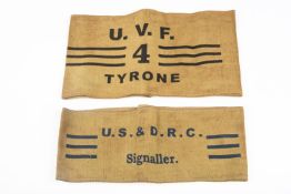 A U.V.F. printed khaki arm band, stamped "U.V.F. 4 Tyrone", also a similar arm band stamped "US &