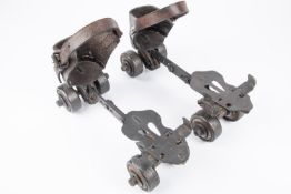 A pair of vintage roller skates, steel bodies marked "Gloria" and "Helios", original leather