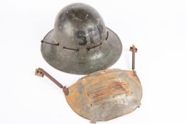 A WWII civilian "Zuckerman" steel helmet, marked on crown "S.F.P"; also a pressed steel splinter