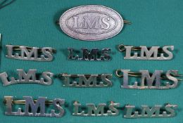 10x LMS Railway chrome shoulder/collar titles and cap badges. GC-VGC. £40-60
