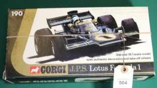 A Corgi Toys 1:18 scale J.P.S. Lotus Formula 1. In black with gold highlighting. 'With authentic