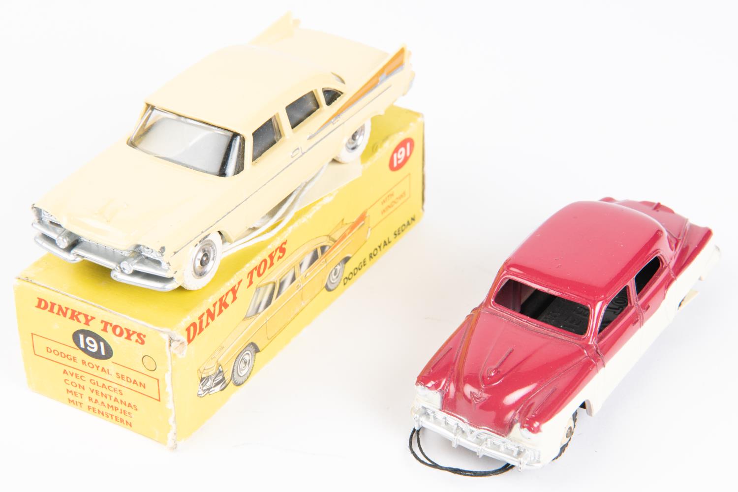 2 Dinky Toys American Cars. Dodge Royal Sedan (191). Example in cream with light brown flash, plated