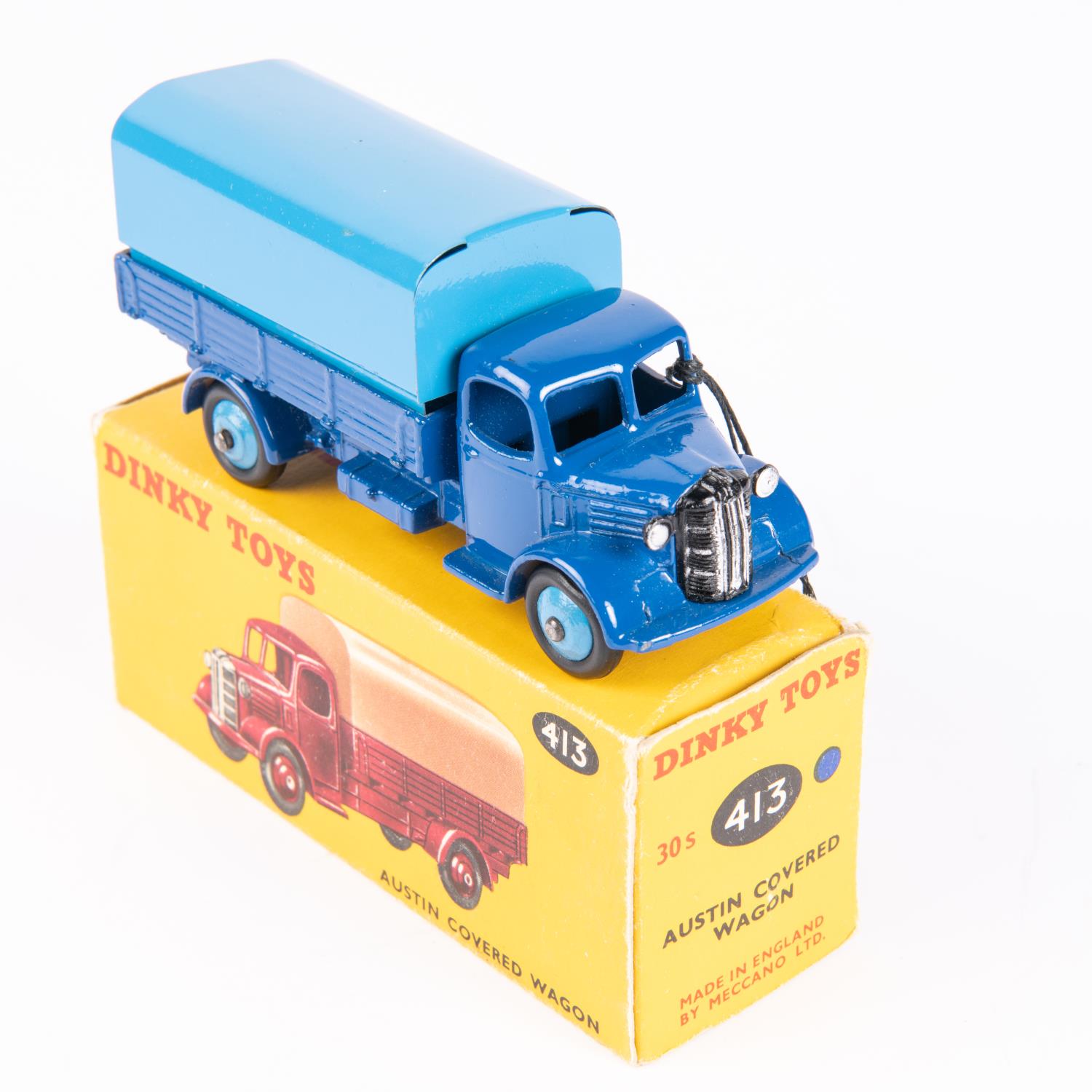 A Dinky Toys Austin Covered Wagon (413). In dark blue with mid-blue tin-plate tilt and wheels.