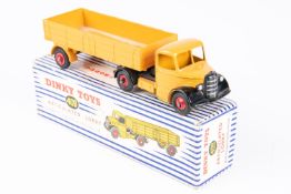 Dinky Toys Articulated Lorry (409). In deep yellow with red wheels. Boxed, minor wear. Vehicle