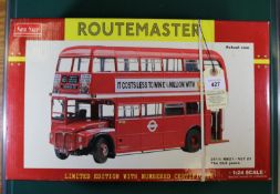 A Sun Star 1:24 scale London Transport Routemaster in red livery with Lucozade and Pearl Assurance
