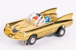 Gold chrome plated classic Batmobile slot racing car, Aurora style. Has figures of Batman and Robin,