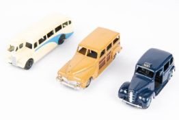 3 Dinky Toys. An Austin TAXI. The later example renumbered 254, in dark blue with mid blue wheel