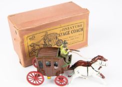 Johillco miniature Stage coach measuring 17cm in length, finished in brown with green and gold