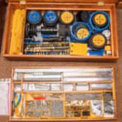 An impressive purpose made 2 layer wooden cabinet containing a large number of Meccano components