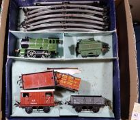 26+ Hornby O gauge tinplate railway items. Including 2x clockwork locomotives; a 101 reversing LMS