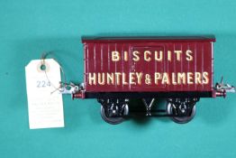 A Hornby Series O gauge Huntley & Palmers Biscuits van in maroon with plastic wheels. VGC, very