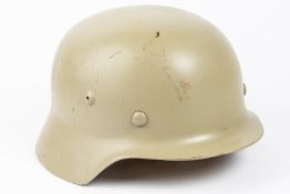 A Third Reich M36 steel helmet, no decals, light grey/green finish, lining possibly post war. VGC £
