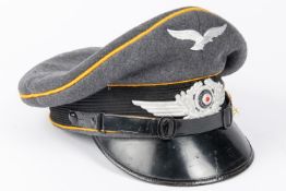 A Third Reich Luftwaffe officer's S.D. cap, with alloy insignia and yellow piping, made by Spohn and