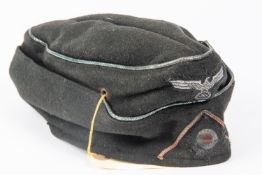 A Third Reich NCO's Panzer side cap, marked inside KDR.Pz. R.G.T. 36, dated 18-1-41. GC £150-200