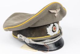 A Third Reich cavalry officer's SD cap, complete with insignia and cap cord. GC (sweatband worn). £