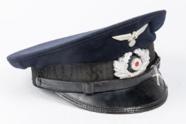 A Third Reich Veterans Association peaked cap, alloy insignia, trade label in lining marked "
