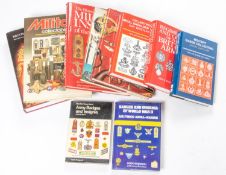 Ten hard back books on badges and militaria, including "British Army Badges" by Lt Col Robin Hodges,
