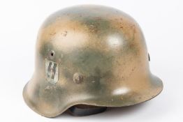 A Third Reich M43 steel helmet, camouflaged finish, SS decal, lining possibly later replacement.