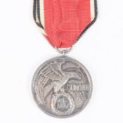 A Third Reich Blood Order, silver medal with ribbon, near VGC. £1,250-1300.