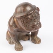 A WWII pottery bulldog figurine, with Winston Churchill's type face wearing steel helmet. GC £70-80