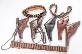 5 leather revolver holsters, 2 with straps; 3 looped cartridge bandoliers; 18 deactivated Martini