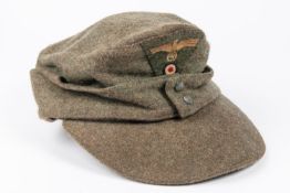 A Third Reich ORs field cap, embroidered badges. GC £65-70