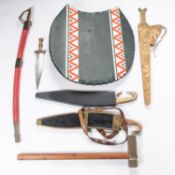 Three ancient Greek or Assyrian style re-enactment swords, in their scabbards; a similar short
