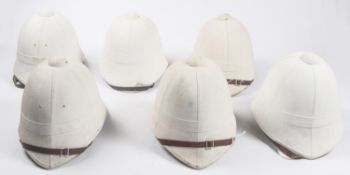 6 reproduction Zulu War foreign service white helmets, leather chin straps. GC £50-60
