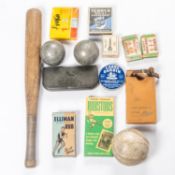 An old turned oak short baseball bat, a stitched leather ball, several vintage accessories in