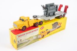 A Dinky Supertoys Mighty Antar with Transformer load (908). Yellow tractor unit with grey trailer,