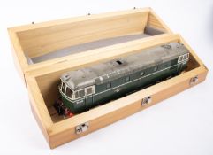 An O gauge BR Class 33 Bo-Bo diesel locomotive, D6535, in dark green and grey livery. With brass