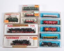 11 N gauge model railway rolling stock. 6x Fleischmann: 2x DB steam locomotives, 2-10-0 tender