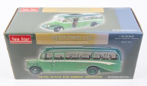 A Sun Star 1:24 scale Bedford OB Coach. In Southdown two-tone green livery. Registration No. JCD